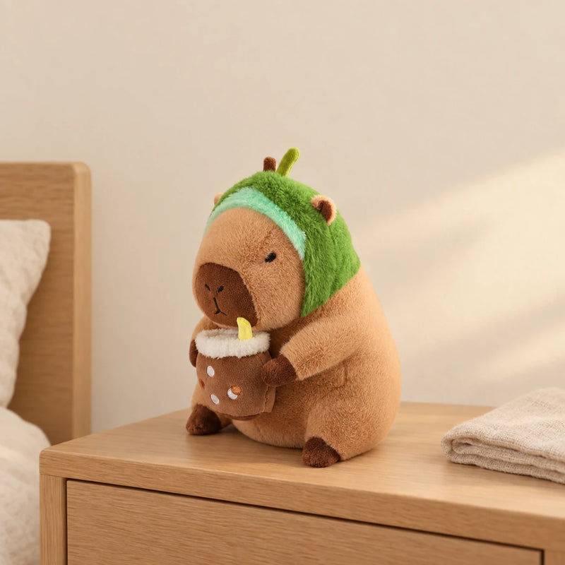 Peluche capybara avec boisson et bonnet rigolo