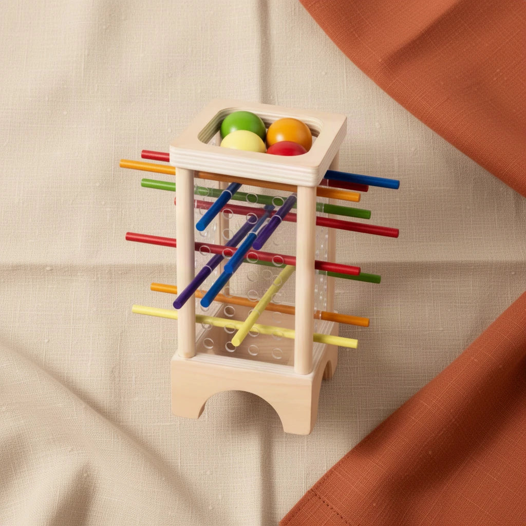Tour à Billes et Bâtonnets Colorés Montessori vu de dessus, posé sur du lin