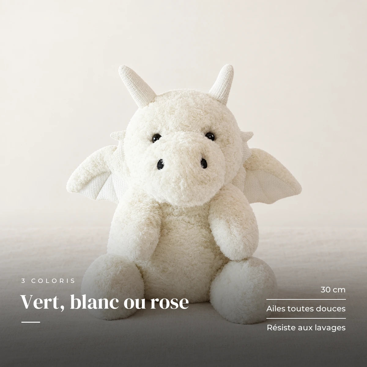 Dragon moelleux en peluche 30 cm blanc sur fond crème, en studio. Vert, blanc ou rose : 30 cm, ailes toutes douces, résiste aux lavages