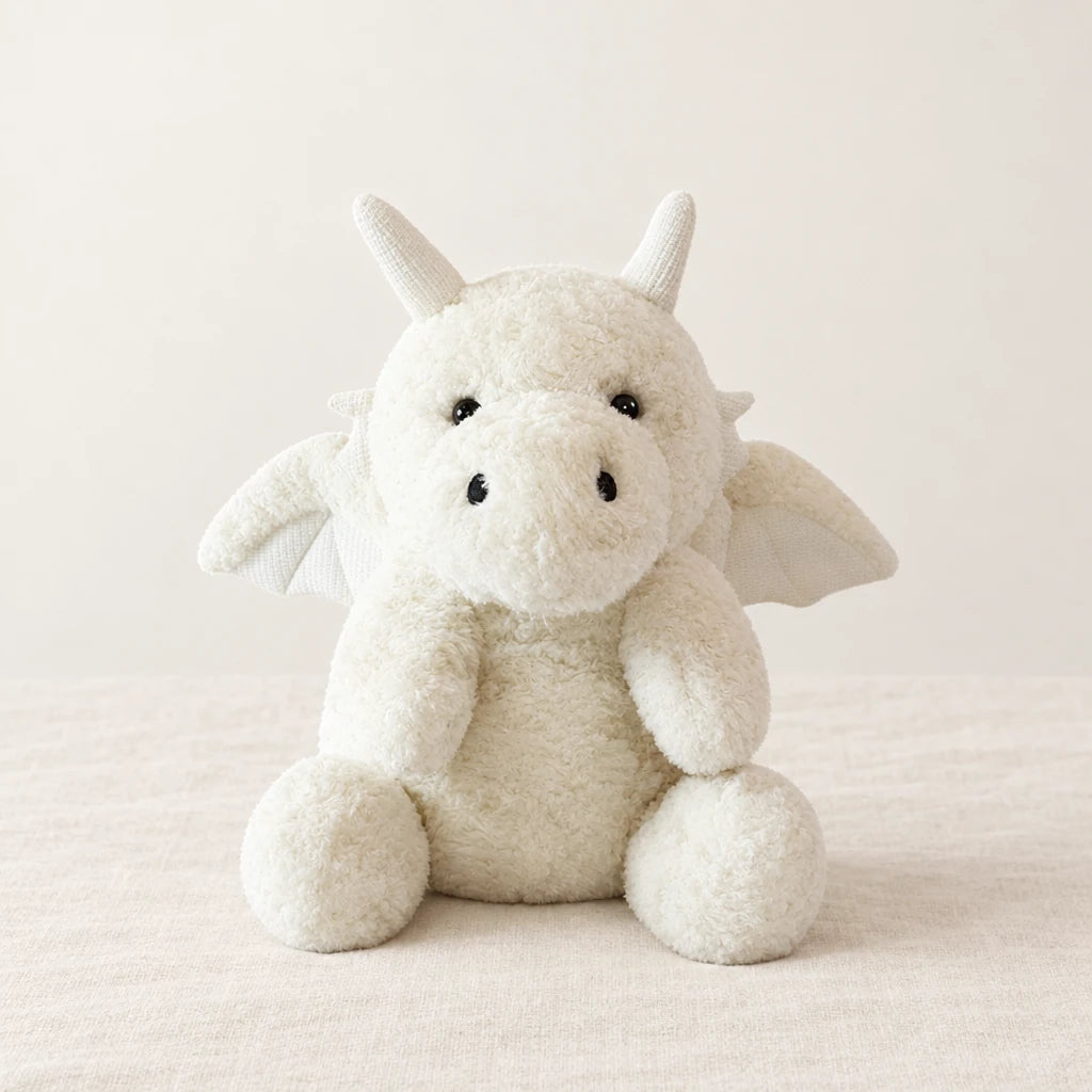 Dragon moelleux en peluche 30 cm blanc sur fond crème, en studio