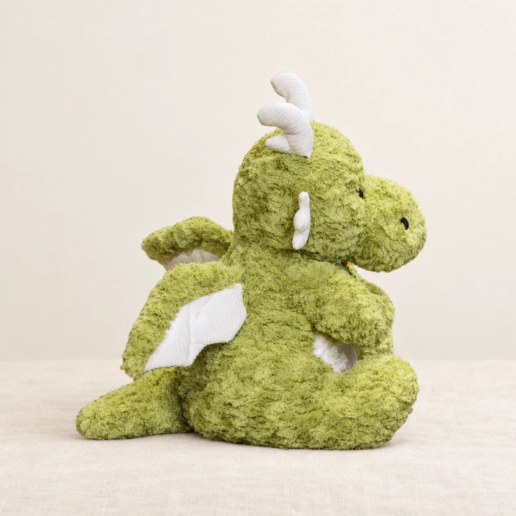 Dragon moelleux en peluche 30 cm sur fond crème, en studio