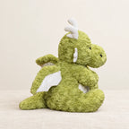 Dragon moelleux en peluche 30 cm sur fond crème, en studio