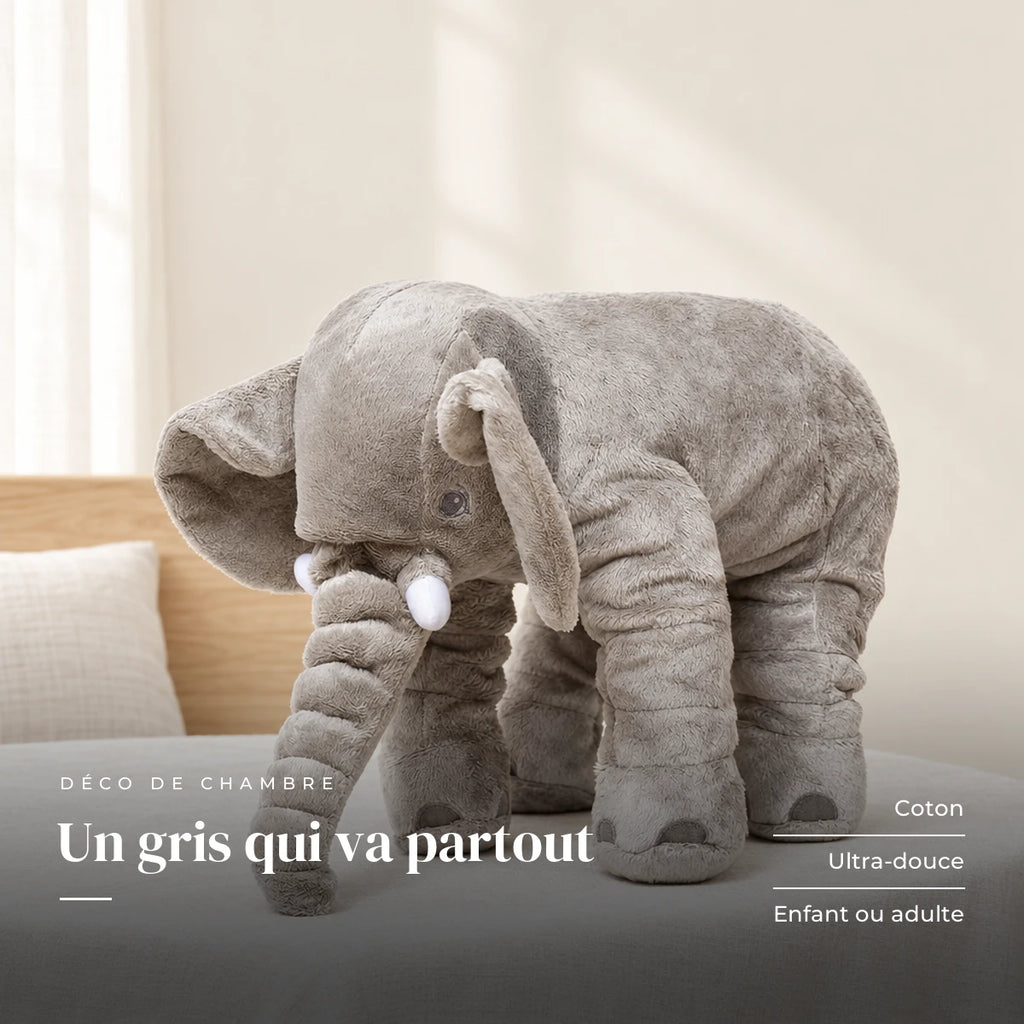 Peluche éléphant oreiller grise sur fond crème, en studio. Un gris qui va partout : coton, ultra-douce, enfant ou adulte