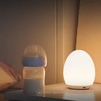 Veilleuse maternité œuf en action : lumière douce pour la tétée