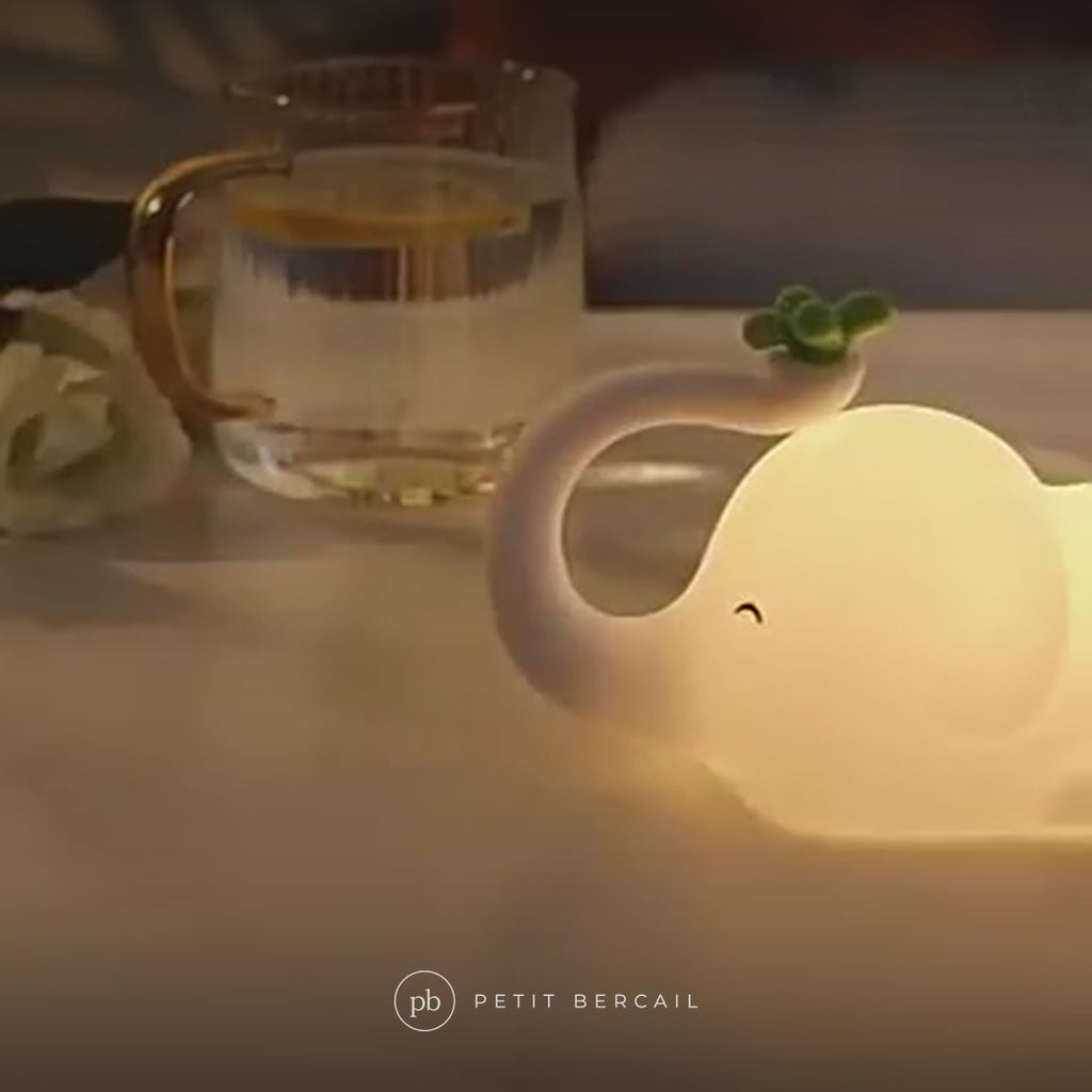 Veilleuse éléphant en action : lumière chaude et minuterie