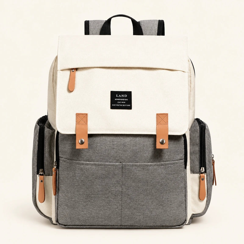 Sac à dos à langer 25 L avec matelas à langer sur fond clair