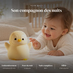 Veilleuse pingouin rechargeable utilisée la nuit dans la chambre de bébé